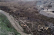 Afghan landslide toll 2,000, site may become massive grave